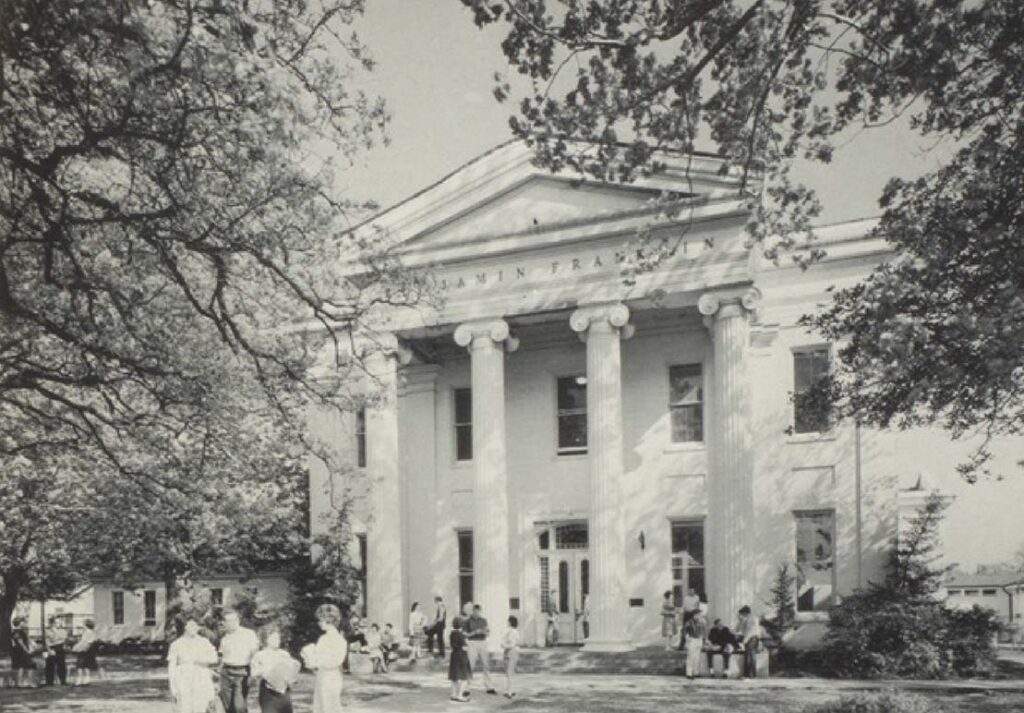 Black and white photo of the front of Benjamin Franklin High School in 1957