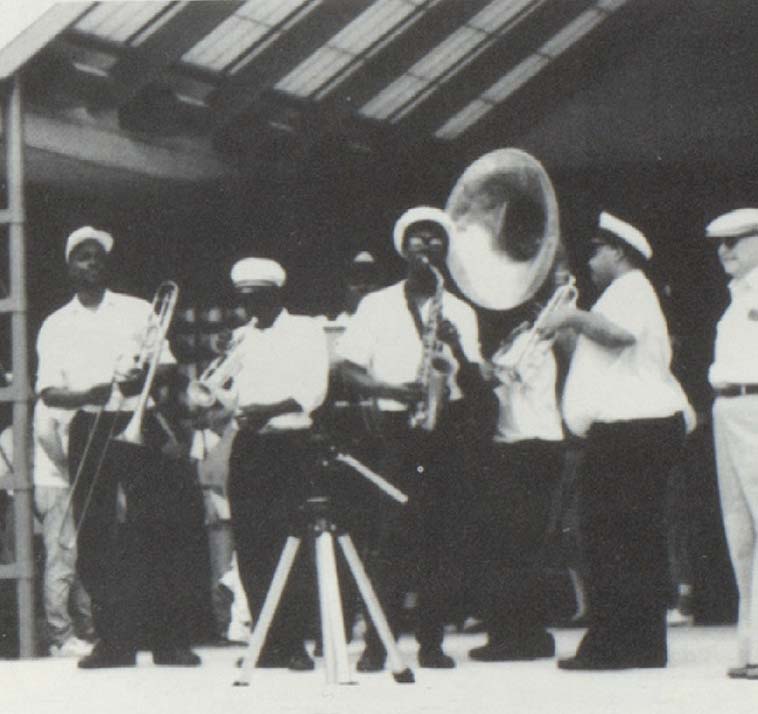 Black and white photo of students playing brass instruments