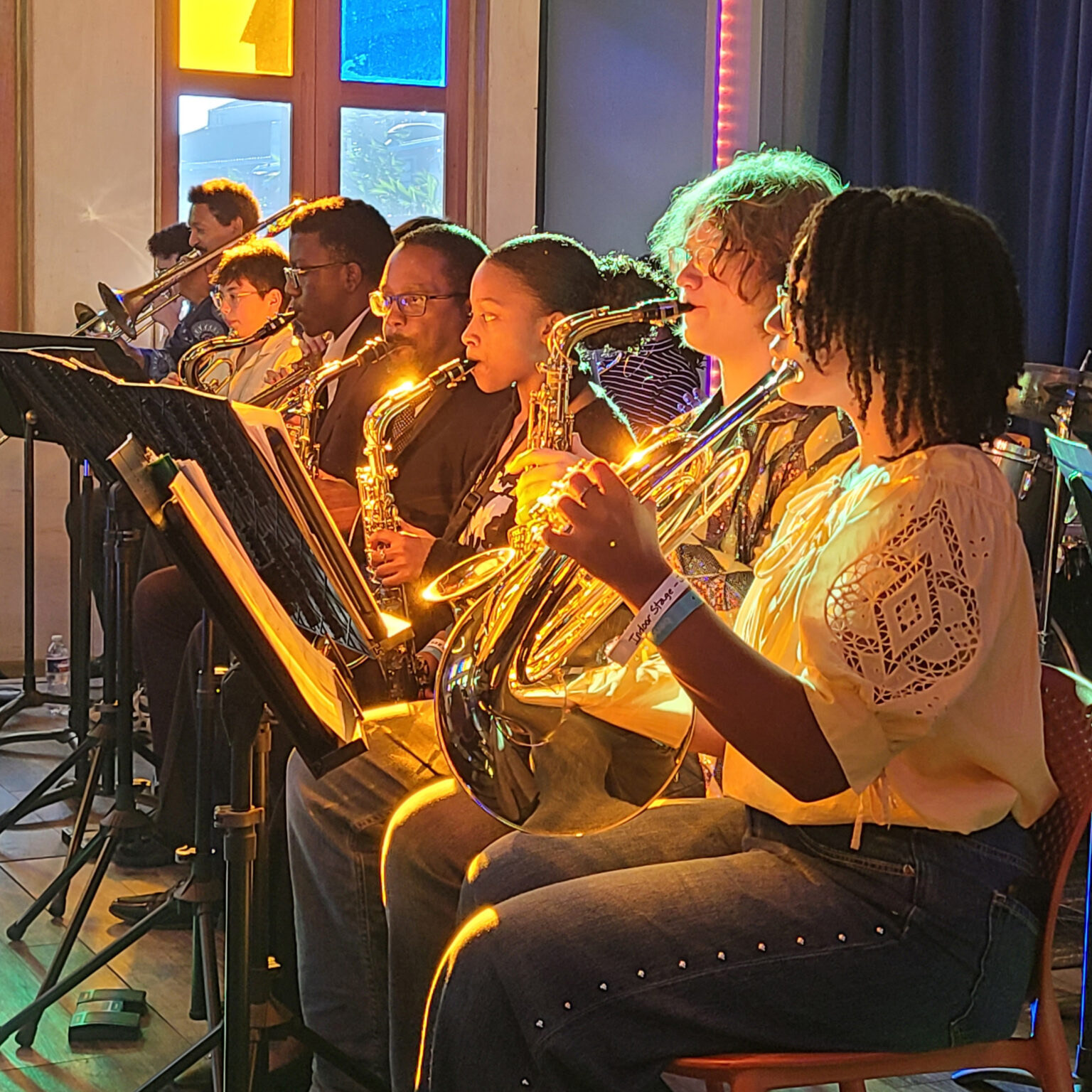 students playing in orchestra with sunlight at bennaroo