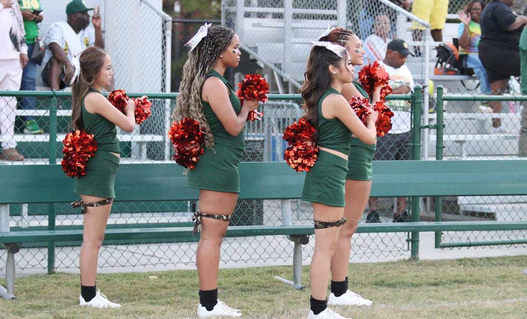 Four cheerleaders in Spirit Teams